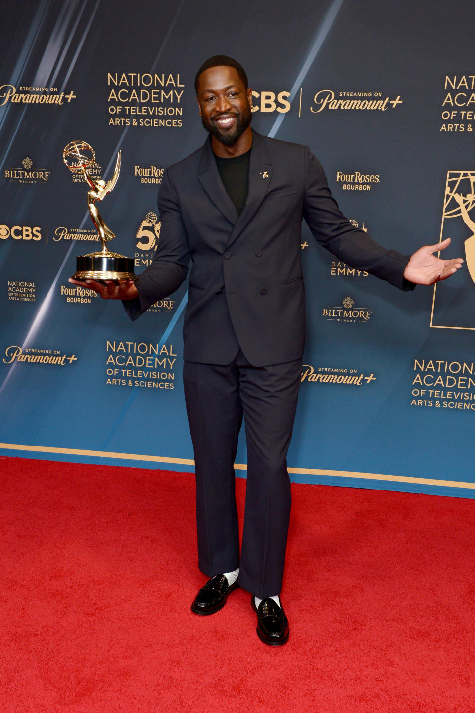 Dwyane Wade poses with Emmy during the 51st Annual Daytime Emmy Creative Arts & Lifestyle Awards