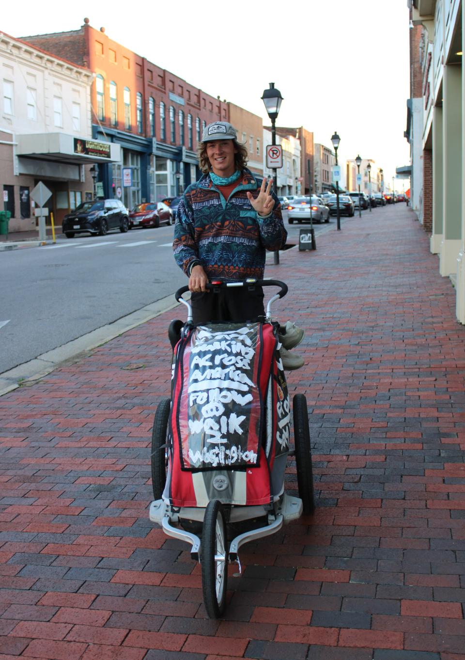 Holden Minor Ringer strikes a pose along North Sycamore Street in Petersburg on Feb. 29, 2024.