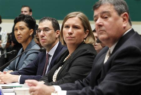 (L-R) Cheryl Campbell, Senior Vice President of CGI Federal; Andrew Slavitt, Executive Vice President for Optum/QSSI; Lynn Spellecy, corporate counsel for Equifax Workforce Solutions and John Lau, program director for Serco are pictured at a House Energy and Commerce Committee hearing on the Patient Protection and Affordable Care Act on Capitol Hill in Washington, October 24, 2013. REUTERS/Jason Reed