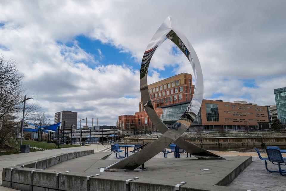 A sculpture gifted to the City of Lansing for it’s 150th anniversay is eye-catching and is along the Lansing River Trail in Rotary Park, and is called “Inspiration.” Photo: Thursday, April 21, 2022. 
