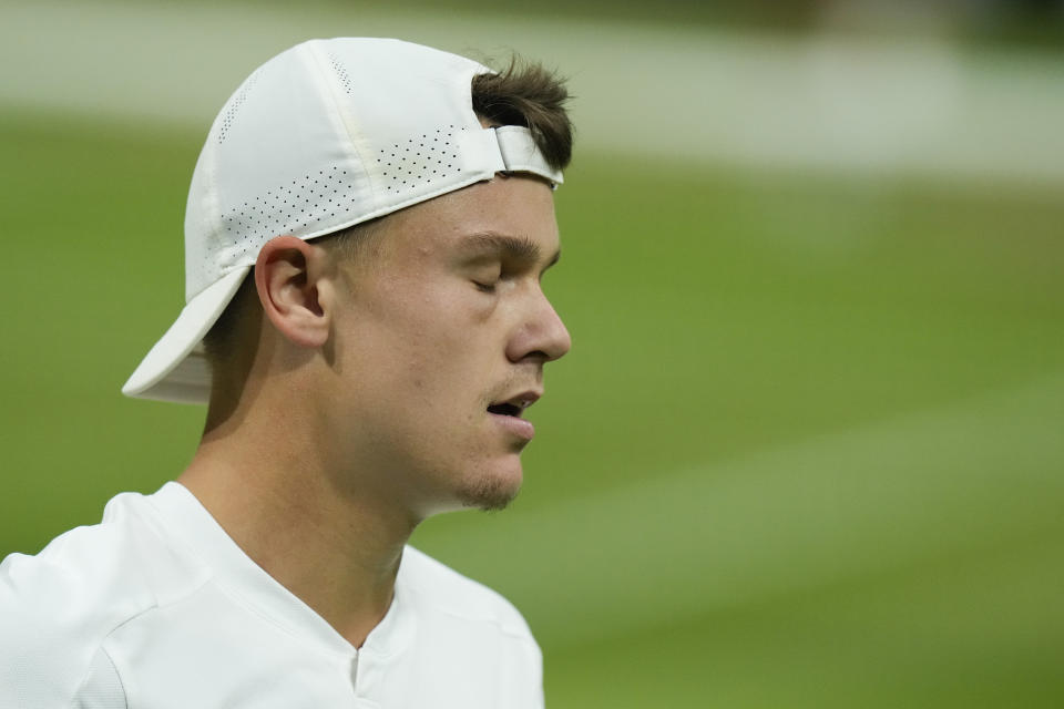 Holger Rune of Denmark reacts during his fourth round match against Novak Djokovic of Serbia at the Wimbledon tennis championships in London, Monday, July 8, 2024. (AP Photo/Mosa'ab Elshamy)