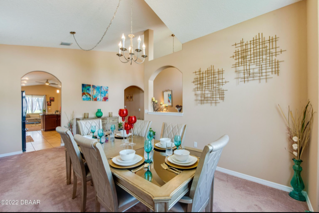 Beautiful architectural and design details are on display throughout the interior, including this dining room.