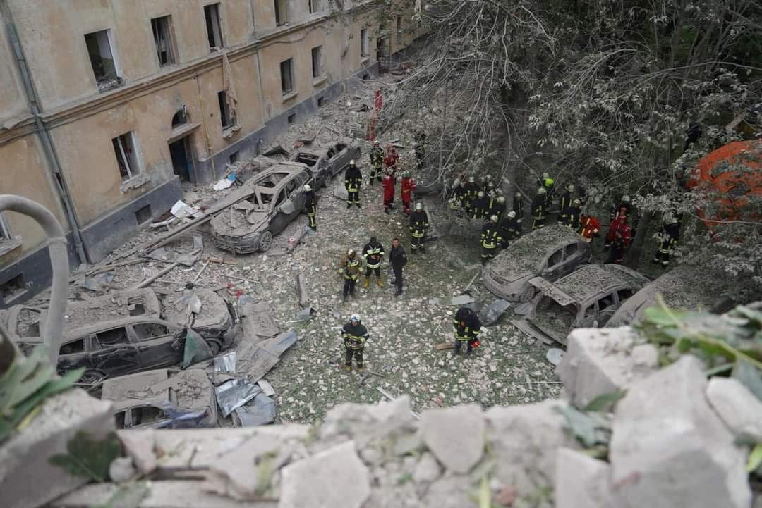 Rescuers work at the site of the attack (via REUTERS)