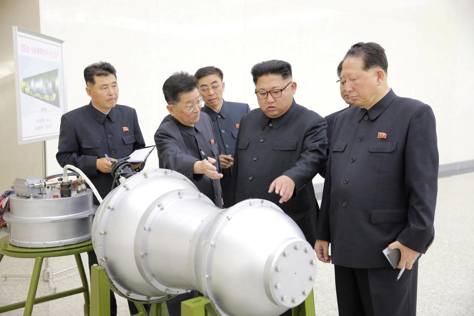 <p>North Korean leader Kim Jong Un provides guidance with Ri Hong Sop (2nd L) and Hong Sung Mu (R) on a nuclear weapons program in this undated photo released by North Korea’s Korean Central News Agency in Pyongyang September 3, 2017. (Photo: KCNA/via Reuters) </p>