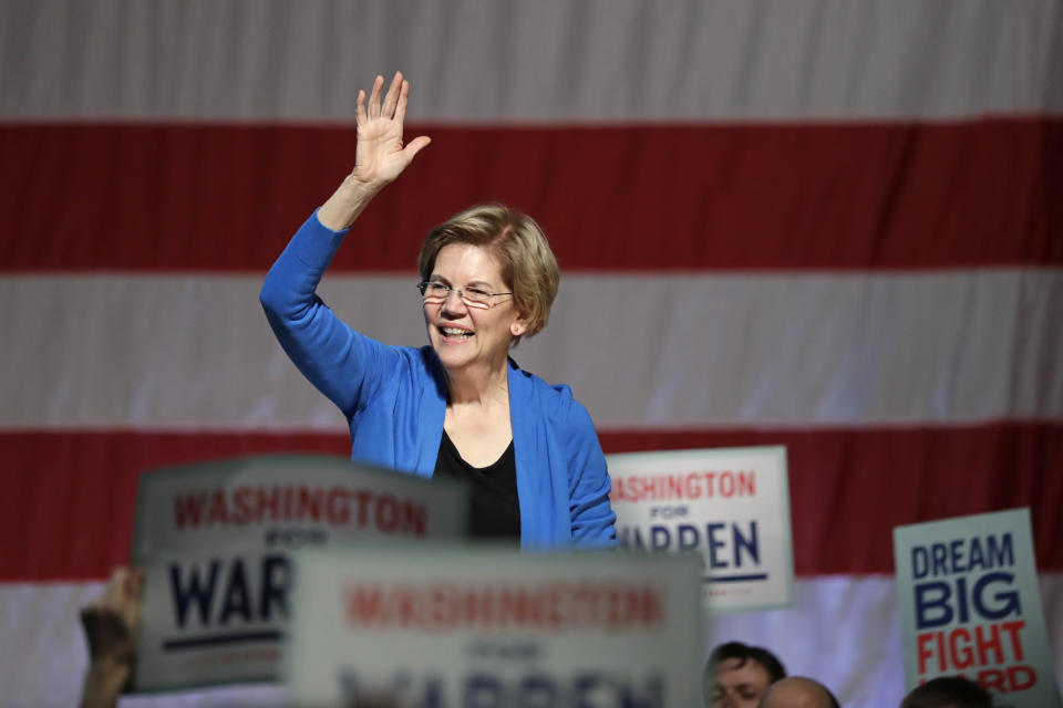 Democratic presidential candidate U.S. Sen. Elizabeth Warren, D-Mass., waves as she is introduced during a campaign event Saturday, Feb. 22, 2020, in Seattle. (AP Photo/Elaine Thompson)