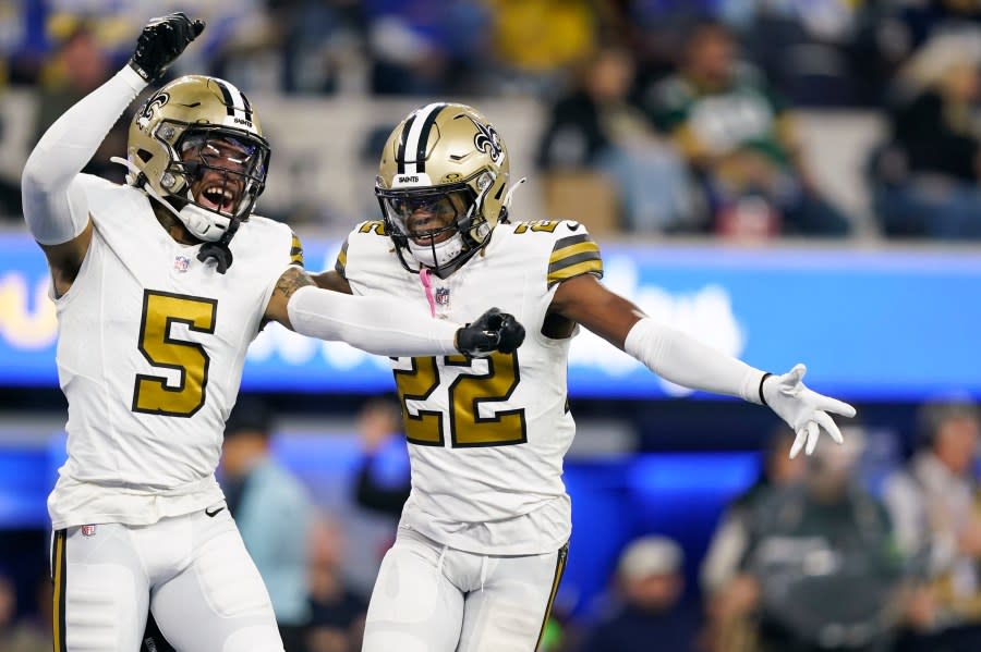 New Orleans Saints wide receiver Rashid Shaheed, right, celebrates his touchdown catch with wide receiver Lynn Bowden Jr. (5) during the first half of an NFL football game against the Los Angeles Rams, Thursday, Dec. 21, 2023, in Inglewood, Calif. (AP Photo/Ryan Sun)