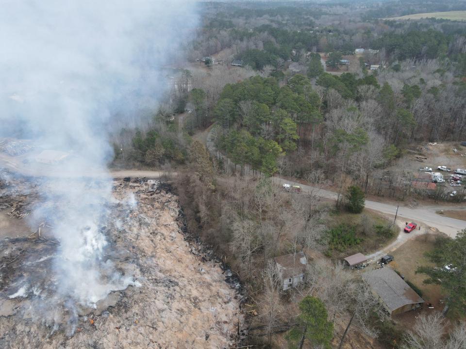 Fire burns beneath a landfill in St. Clair County, Alabama, in a photo released by Moody Fire Department on Dec. 19, 2022.