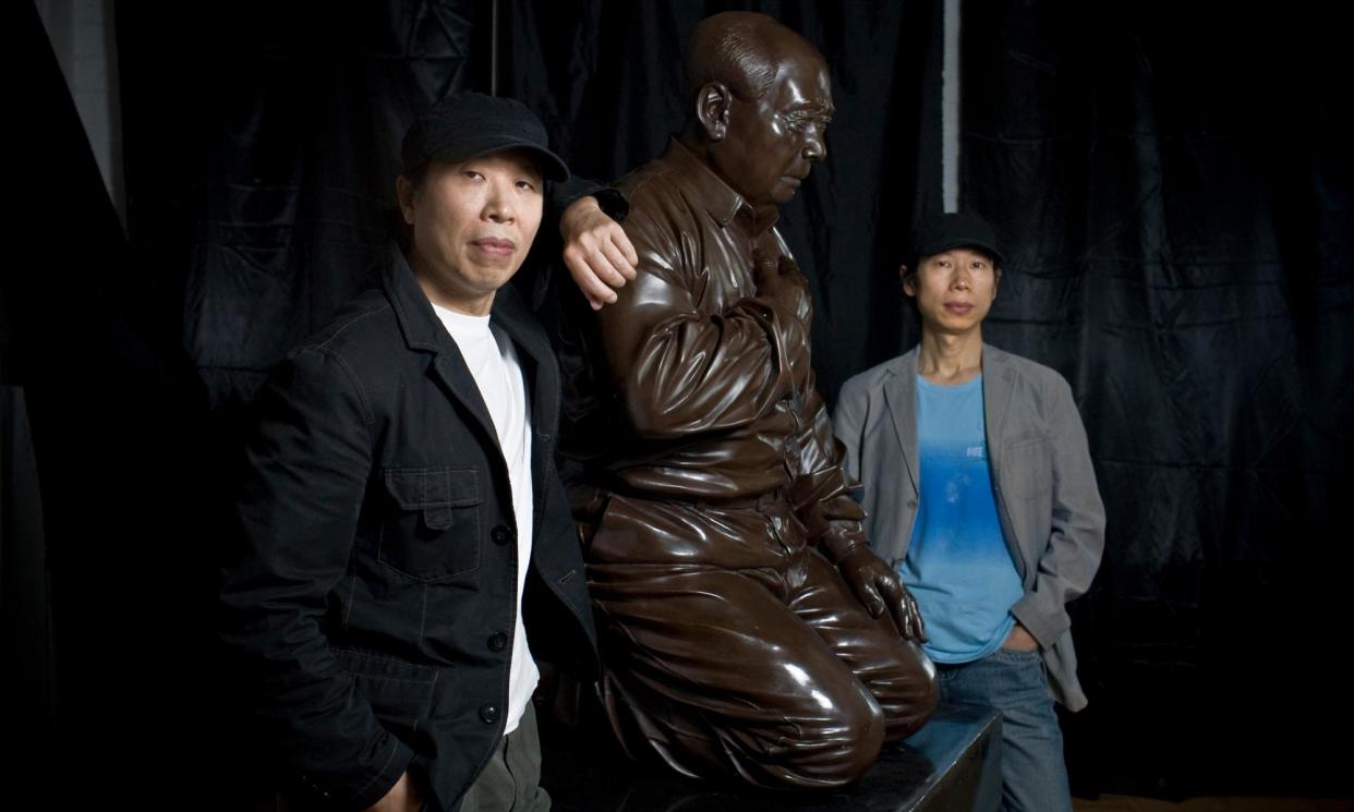 <span>Gao Zhen, left, and Gao Qiang, with their artwork Mao's Guilt in Beijing in 2009.</span><span>Photograph: Shiho Fukada/New York Times/Redux/eyevine</span>