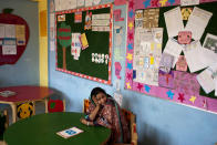 <p>Humaira Bachal, the founder of a charity school sits on a chair in a classroom in Karachi, Pakistan on Feb. 24, 2014. At the age of 13, Bachal began teaching other girls what she learned in school. Those classes at home between friends grew into her life’s work: Bringing education to children in the working-class Muwach Goth neighborhood on the outskirts of Pakistan’s port city of Karachi, where families often keep their girls out of school and where even boys struggle to get decent learning. (AP Photo/Shakil Adil) </p>