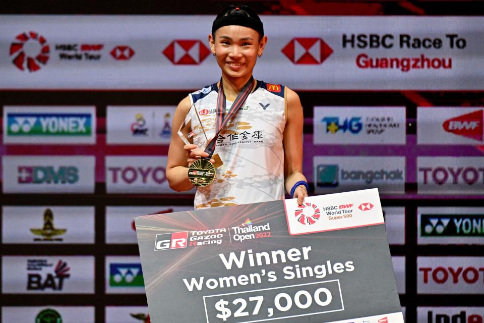 Taiwan's Tai Tzu-ying poses with her medal and trophy after beating China's Chen Yufei to win their women's singles final match at the 2022 Thailand Open badminton tournament in Bangkok on May 22, 2022. (Photo by Lillian SUWANRUMPHA / AFP) (Photo by LILLIAN SUWANRUMPHA/AFP via Getty Images)