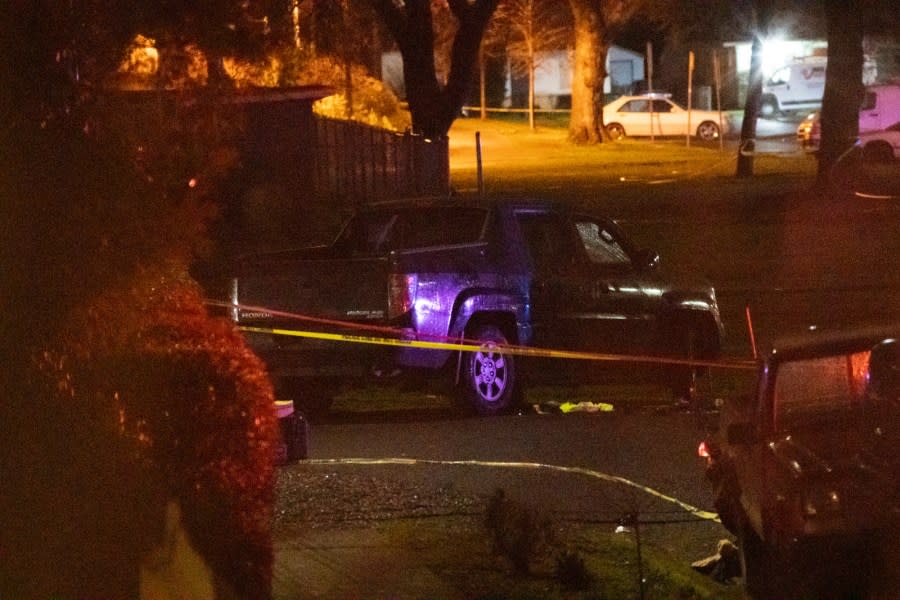 Police respond to a fatal shooting in the area of Normandale Park in Northeast Portland on Saturday evening, Feb. 19, 2022. (Mark Graves/The Oregonian via AP)