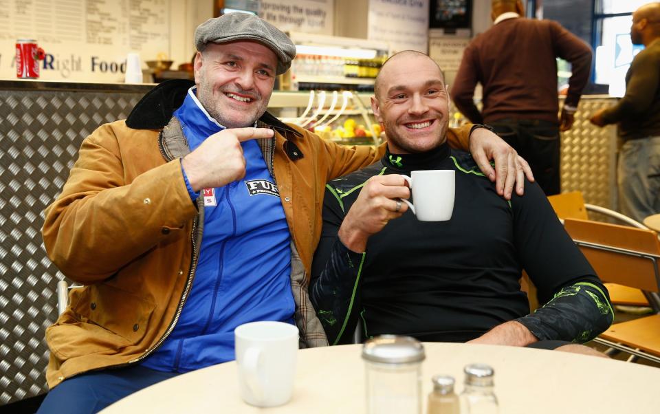 Tyson Fury with father John relaxing in a cafe
