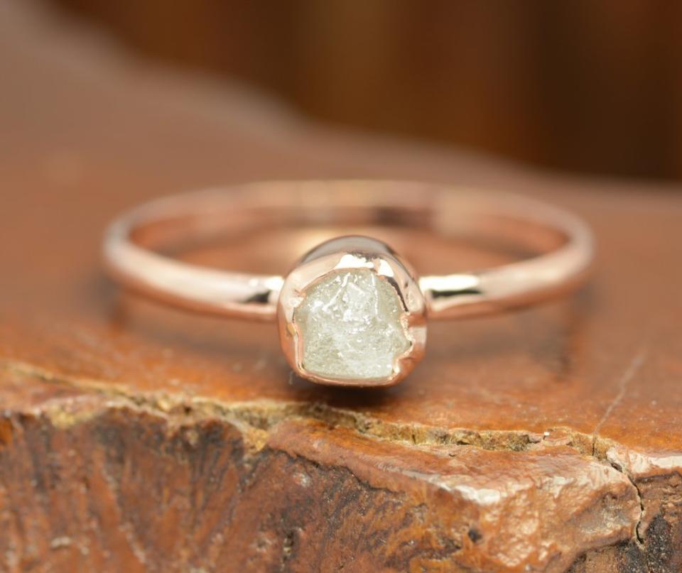 <i>Buy it from&nbsp;<a href="https://pointnopointstudio.com/products/1-carat-rough-diamond-14k-rose-gold-engagement-ring-1" target="_blank">Point No Point Studio</a>&nbsp;for&nbsp;$550</i>