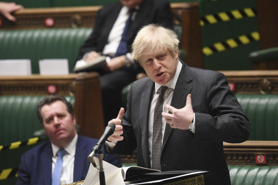 In this photo provided by UK Parliament, Britain's Prime Minister Boris Johnson speaks during the debate in the House of Commons on the EU (Future Relationship) Bill in London, Wednesday, Dec. 30, 2020. The European Union’s top officials have formally signed the post-Brexit trade deal with the United Kingdom, as lawmakers in London get set to vote on the agreement. (Jessica Taylor/UK Parliament via AP)