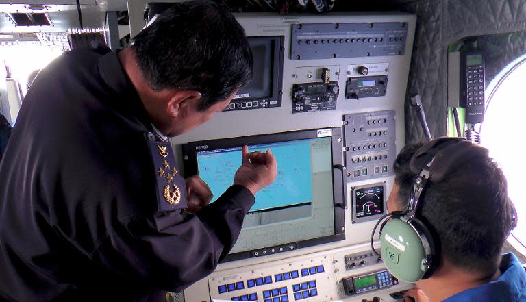 Malaysian Maritime Enforcement personnel use radar to scan for the missing Boeing 777-200 as they fly over the waters off the northeastern coast of the Malaysian peninsula, on March 9, 2014