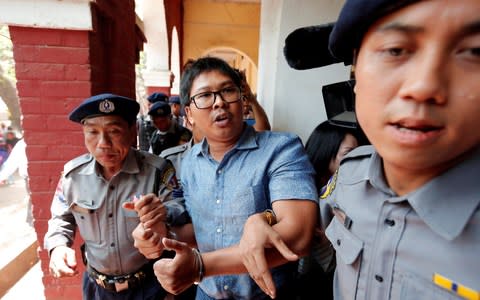 Wa Lone, one of the imprisoned journalists, pictured before a court hearing in Yangon, Myanmar in March - Credit: Reuters