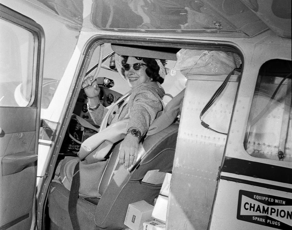 FILE - This photo made March 19, 1964, shows Jerrie Mock getting ready for take-off from Port Columbus, in Columbus, Ohio, on an around-the-world flight. Fifty years ago the 38-year-old mother of three became the first woman to circle the globe alone and set two new aviation records. The Columbus-to-Columbus trip took her to some 20 nations. (AP Photo/Gene Smith)