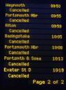 The notice board at Waterloo Station displays cancelled train journeys due to storms in London December 24, 2013. Disrupted transport networks and power cuts wreak havoc in Britain and France on one of the busiest travel and shopping days of the year after hurricane-force winds and torrential rain lashed the region. REUTERS/Luke MacGregor