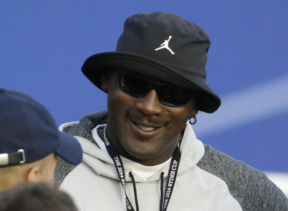 Basketball legend Michael Jordan stands on the 1st tee box during the fourball match on the second day of the Ryder Cup golf tournament, at Gleneagles, Scotland, Saturday, Sept. 27, 2014. (AP Photo/Matt Dunham)