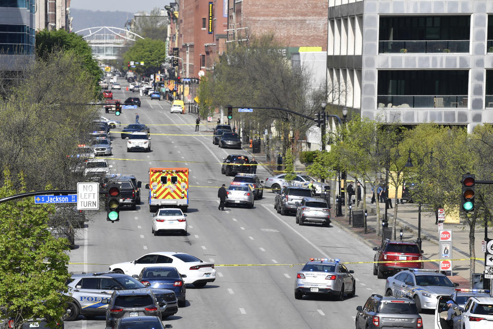 Louisville metro Police and emergency personnel block the streets outside of the Old National Bank building in Louisville, Ky., Monday, April 10, 2023. (AP Photo/Timothy D. Easley)