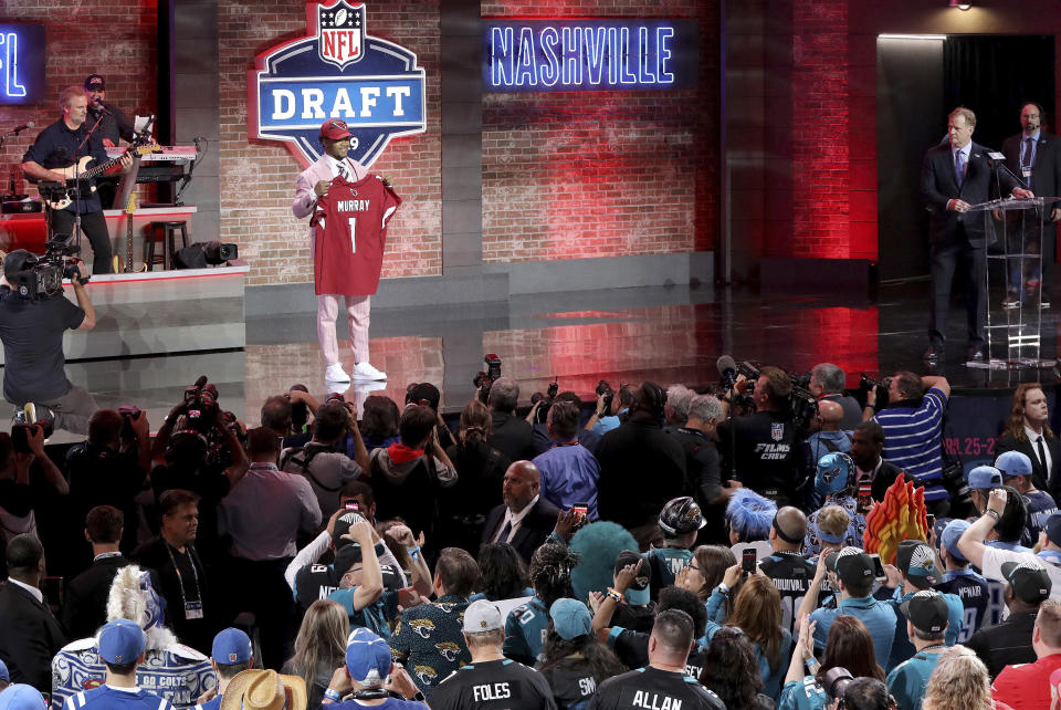 Oklahoma quarterback Kyler Murray shows off his new jersey after the Arizona Cardinals selected Murray in the first round at the NFL football draft, Thursday, April 25, 2019, in Nashville, Tenn. (AP Photo/Gregory Payan)