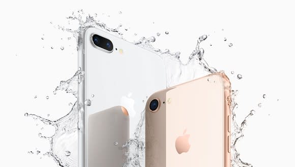 iPhone 8 Plus and iPhone 8 with water splashing around them.