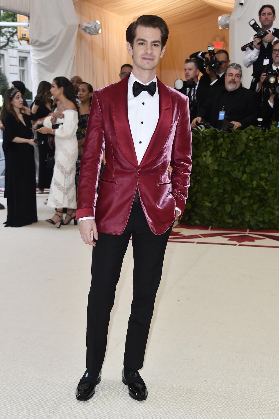 <p>Andrew Garfield ditched his go-to monochrome tux for a Holy Communion wine-hued blazer by Tom Ford. <em>[Photo: Getty]</em> </p>