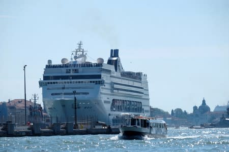 The cruise ship MSC Opera loses control and crashes against a smaller tourist boat at the San Basilio dock in Venice