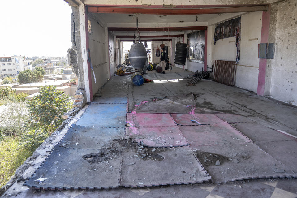 The site of the bomb explosion is seen in the sports club that was attacked on Thursday night, in the west of Kabul, Afghanistan, Friday, Oct. 27, 2023. The blast killed some people and injured others in a Shiite neighbourhood in the Afghan capital Kabul. (AP Photo/Ebrahim Noroozi)
