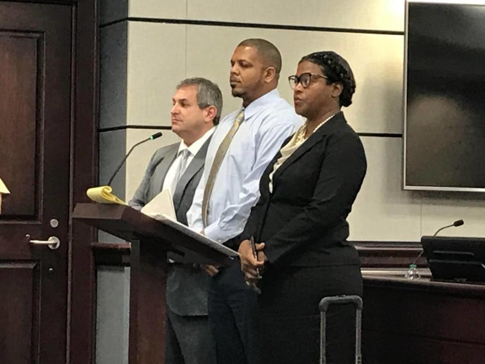 Kenneth Andrew Williams, center, flanked by his two lawyers Gary Lemel and Twana Burris-Alcide, in York County, South Carolina. Williams, former Northwestern High School assistant principal from Rock Hill, pleaded guilty to three sex charges involving a student from 2016.