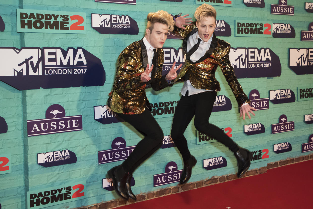 Jedward pose for photographers upon arrival at the MTV European Music Awards 2017 in London, Sunday, Nov. 12th, 2017. (Photo by Vianney Le Caer/Invision/AP)