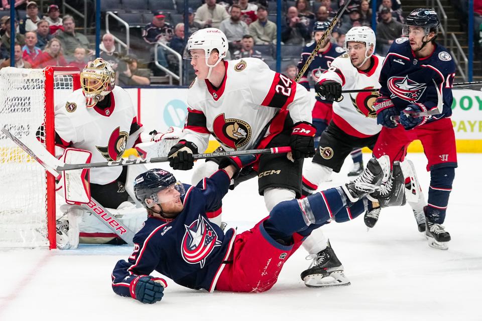 Mar 14, 2024; Columbus, Ohio, USA; Ottawa Senators defenseman Jacob Bernard-Docker (24) hits Columbus Blue Jackets left wing Alexander Nylander (92) during the first period of the NHL hockey game at Nationwide Arena.