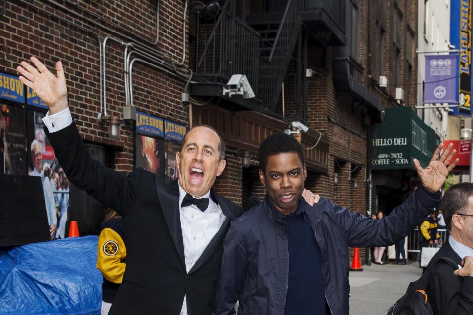 Comedians Jerry Seinfeld (L) and Chris Rock depart Ed Sullivan Theater in Manhattan after taking part in the taping of tonight's final edition of "The Late Show" with David Letterman in New York May 20, 2015. REUTERS/Lucas Jackson