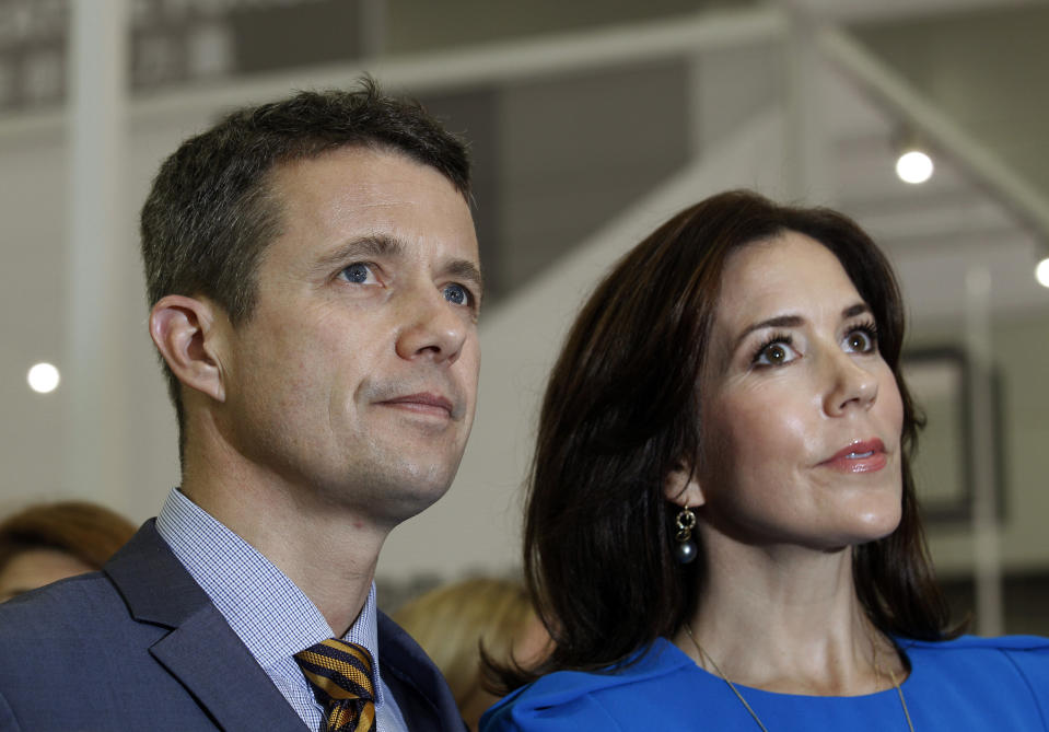 FILE - Danish Crown Prince Frederik and Crown Princess Mary visit the Danish Pavilion during the Business of Design Week in Hong Kong Thursday, Dec. 6, 2012.As a teenager, Crown Prince Frederik felt uncomfortable being in the spotlight, and pondered whether there was any way he could avoid becoming king. All doubts have been swept aside as the 55-year-old takes over the crown on Sunday, Jan. 14, 2024 from his mother, Queen Margrethe II, who is breaking with centuries of Danish royal tradition and retiring after a 52-year reign. (AP Photo/Kin Cheung, File)