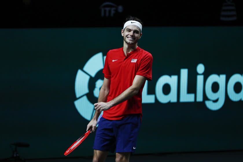 Taylor Fritz of the USA celebrates defeating Italy's Lorenzo Musetti during a Davis Cup quarter-final tennis match between Italy and USA in Malaga, Spain, Thursday, Nov. 24, 2022. (AP Photo/Joan Monfort)