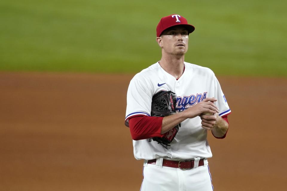 Texas Rangers starting pitcher Kyle Gibson stands on the mound after giving up a solo home run to San Francisco Giants' Chadwick Tromp in the fifth inning of a baseball game in Arlington, Texas, Wednesday, June 9, 2021. (AP Photo/Tony Gutierrez)