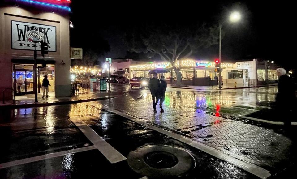 Light rain began falling in downtown San Luis Obispo on Wednesday night, Jan. 31, 2024, as an atmospheric river storm arrived.