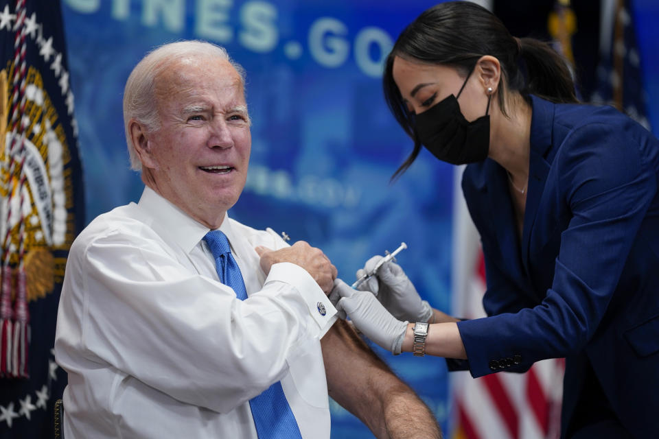 FILE - President Joe Biden receives his COVID-19 booster from a member of the White House medical unit during an event in the South Court Auditorium on the White House campus, Oct. 25, 2022, in Washington. (AP Photo/Evan Vucci, File)