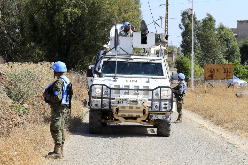 U.N. peacekeepers patrol on the Lebanese side of the Lebanese-Israeli border in the southern village of Wazzani, Thursday, July 6, 2023. Israeli forces shelled a southern Lebanese border village on Thursday after several explosions were heard in a disputed area where the borders of Syria, Lebanon and Israel meet. (AP Photo/Mohammad Zaatari)