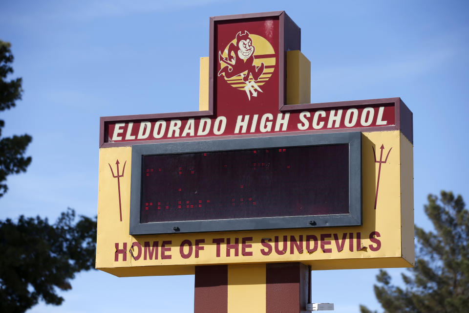 FILE - An electronic sign stands outside Eldorado High School in Las Vegas Friday, April 8, 2022. A Las Vegas teenager has pleaded guilty as an adult to felony charges Wednesday, April 19, 2023, that a prosecutor says could get him decades in prison for attacking a high school teacher and leaving her unconscious in a classroom after school a year ago. (Steve Marcus/Las Vegas Sun via AP, File)