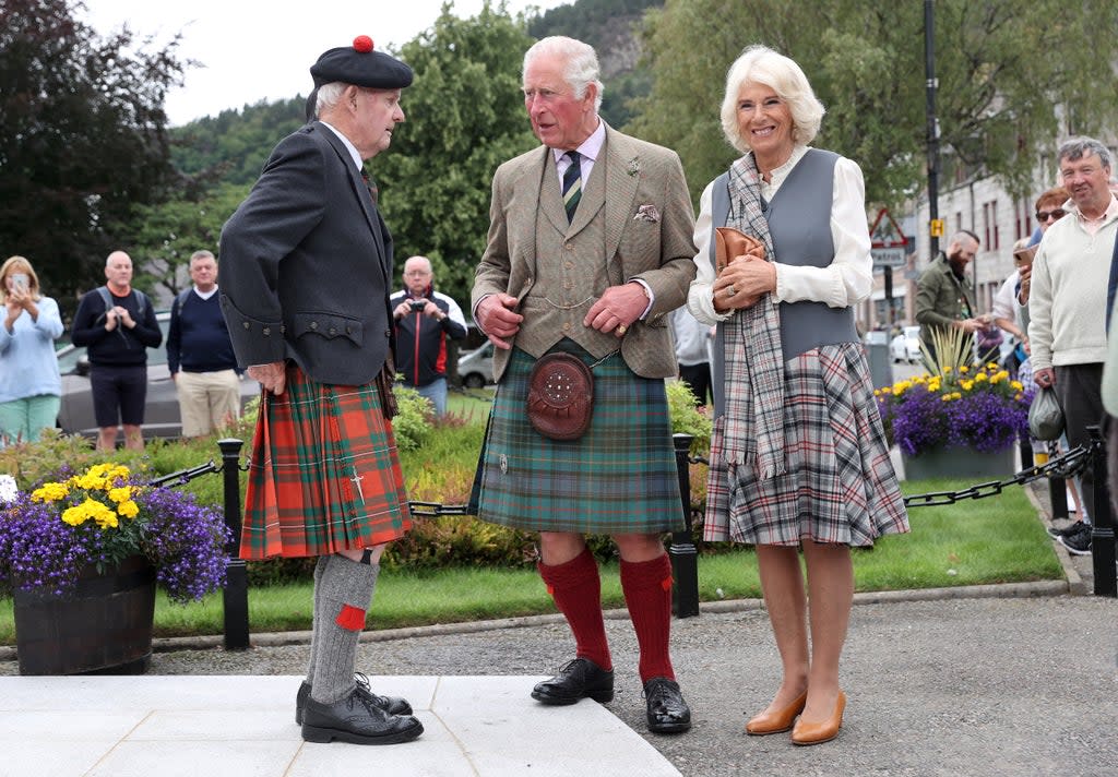 Charles wore a kilt in Balmoral tartan complete with a sporran and a Tweed blazer while Camilla wore a matching grey tartan shawl  (Getty Images)