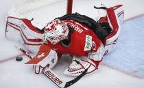 Switzerland goalie Andrea Braendli blocks the net against a shot from the United States during the third period of an IIHF women's hockey championship game in Calgary, Alberta, Friday, Aug. 20, 2021. (Jeff McIntosh/The Canadian Press via AP)