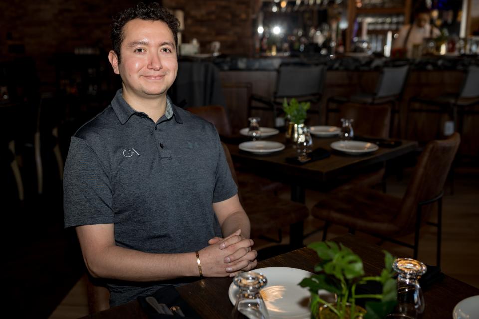 Owner and marketing manager of the Great American Steakhouse, Andres Orozco, sits at the newly remodeled Great American Steakhouse in Northeast El Paso on Tuesday, Jan. 9, 2024. The restaurant recently reopened right before the new year.