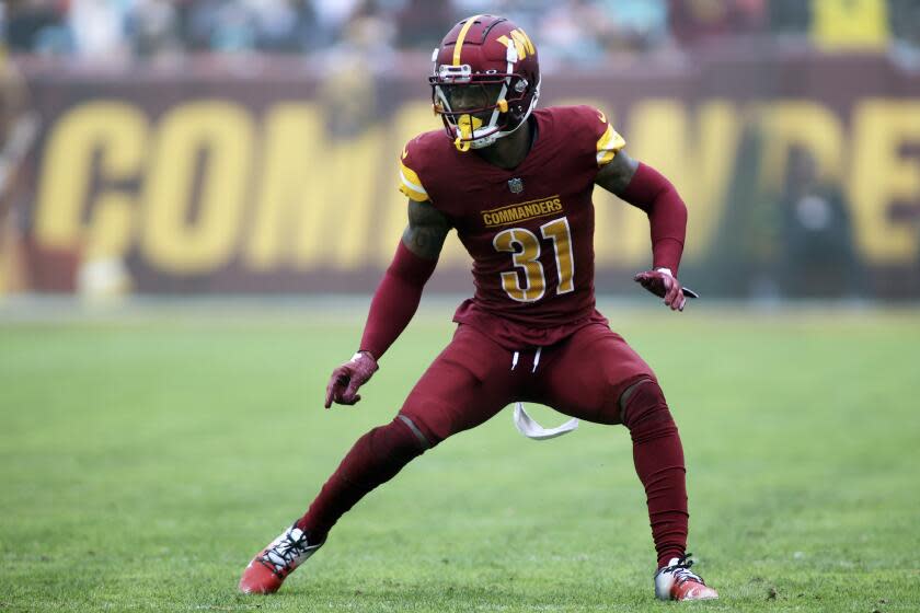 Washington Commanders safety Kamren Curl (31) runs during an NFL football game.