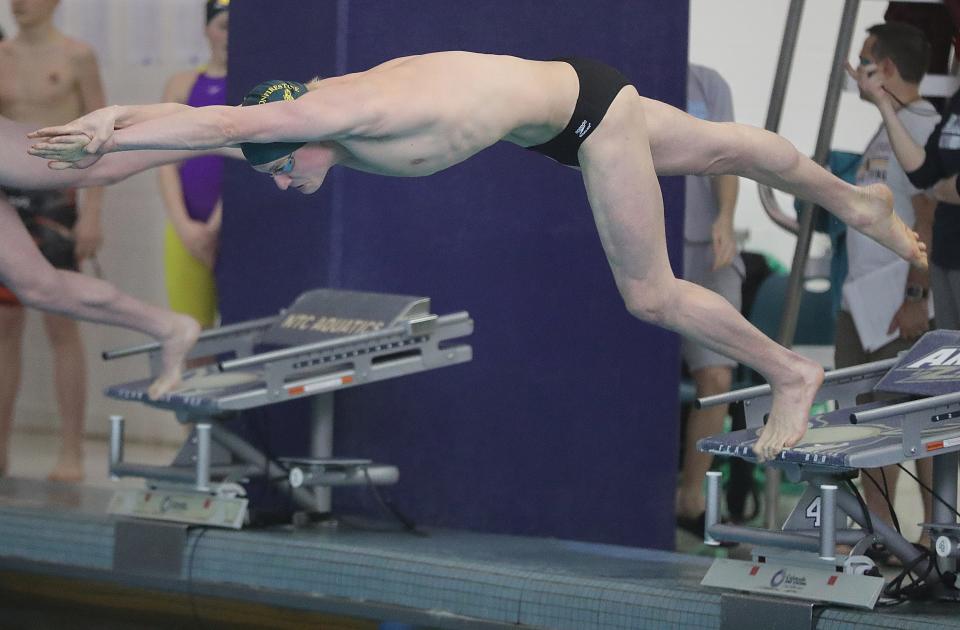 Firestone senior Jonny Marshall dives into the pool at the start of the 200 yard freestyle event in the Division I Sectional Championships on Saturday, Feb. 11, 2023 in Akron, Ohio, at the University of Akron's Ocasek Natatorium. Marshall set a meet record in the event.