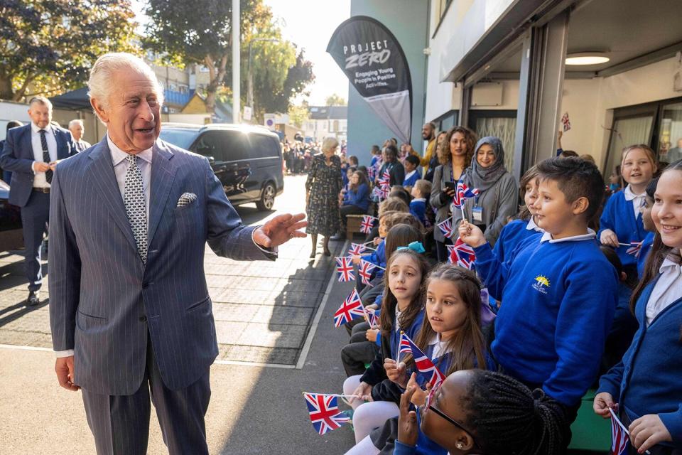 Britain's King Charles III is welcomed as he arrives to meet with members and staff of the association "Project Zero", an organisation dedicated to engaging young people in positive activities, promoting social inclusion and strengthening community cohesion, during a visit of the center in Walthamstow, in east London, on October 18, 2022.