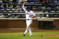 New York Mets Michael Conforto reacts after scoring against the Atlanta Braves in the seventh inning of a baseball game. Wednesday, June 23, 2021, in New York. (AP Photo/Noah K. Murray)