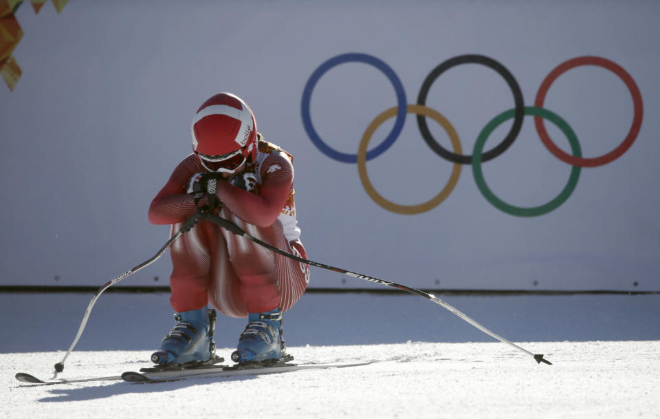 Switzerland's Dominique Gisin rests after a women's downhill training run for the Sochi 2014 Winter Olympics, Saturday, Feb. 8, 2014, in Krasnaya Polyana, Russia. (AP Photo/Gero Breloer)