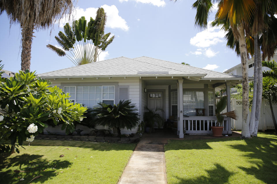 The home where U.S. defense contractor Walter Glenn Primrose and his wife, Gwynn Darlle Morrison, lived for years allegedly under aliases is pictured, Wednesday, July 27, 2022, in Kapolei, Hawaii. They have been charged with identity theft and conspiring against the government after prosecutors allege they stole the identities of dead Texas children decades ago. (AP Photo/Caleb Jones)