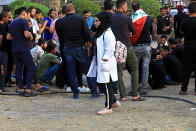 In this Tuesday, Sept. 18, 2018 photo, Hajar Youssif, an Iraqi activist and volunteer medic, who was kidnapped, beaten and threatened for attending protests, stands by to support protesters, in Basra, Iraq. Activists say powerful Iranian-backed militias that control Iraq’s oil capital of Basra have waged a campaign of intimidation and arbitrary arrests to silence protests aimed at poor government services and Tehran’s outsized influence in the region. (AP Photo/Nabil al-Jurani)